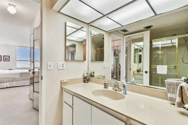 bathroom with vanity and an enclosed shower