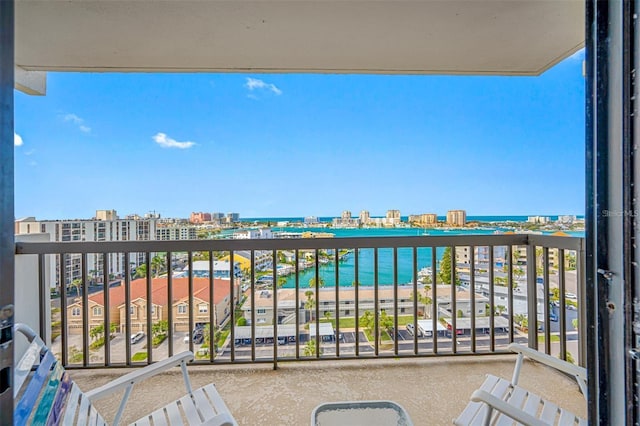 balcony featuring a water view