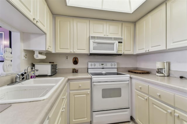 kitchen with white appliances and sink