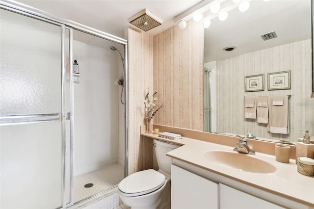 bathroom with vanity, toilet, and walk in shower