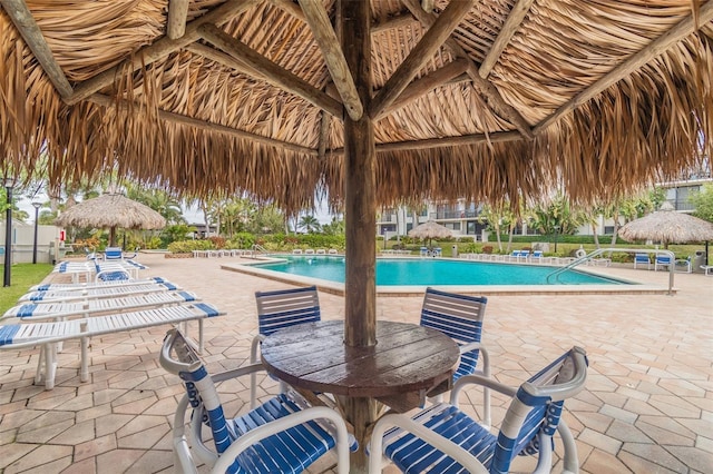 view of swimming pool with a gazebo and a patio