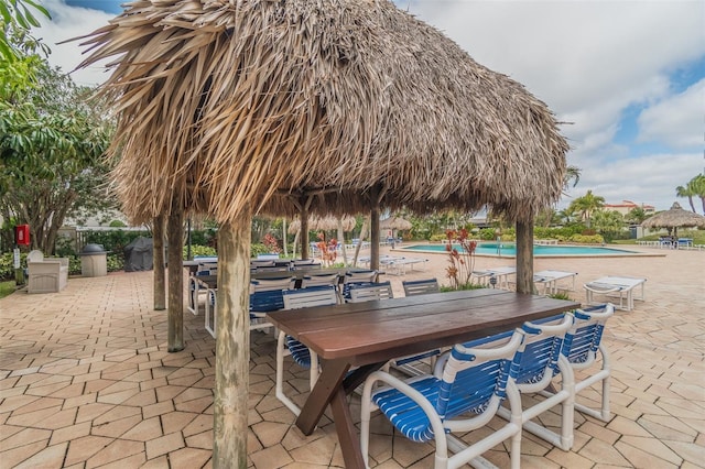 view of home's community featuring a patio and a swimming pool