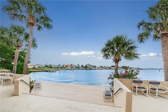 exterior space with a water view and exterior kitchen