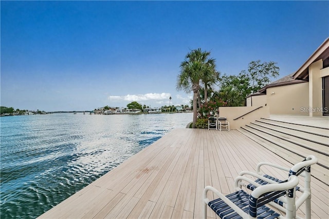 deck featuring a water view