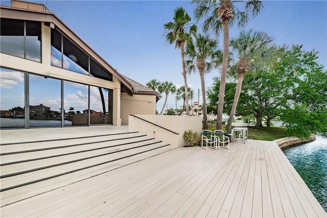 wooden deck with a water view