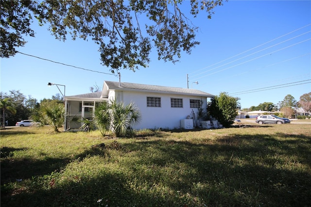 view of home's exterior featuring a yard