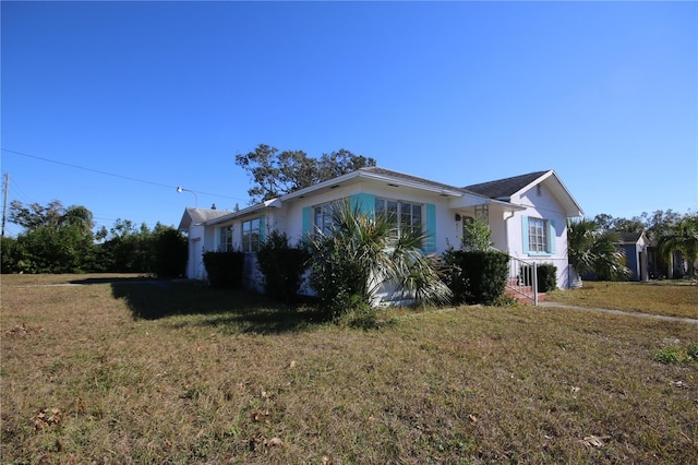 view of property exterior featuring a lawn