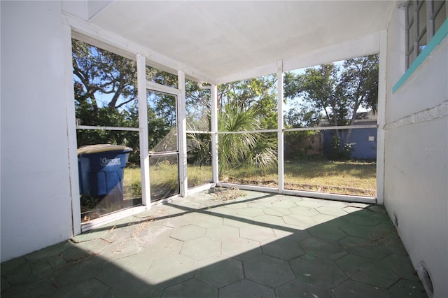 unfurnished sunroom with plenty of natural light