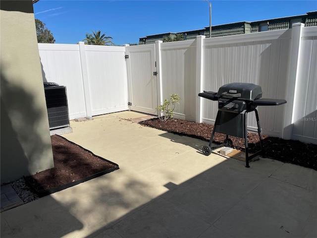 view of patio / terrace featuring a grill and central air condition unit