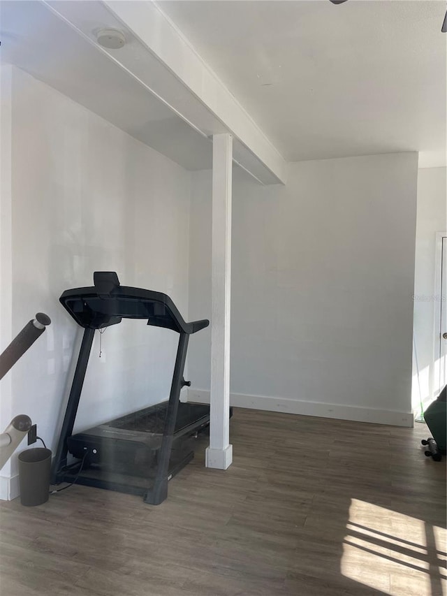 workout area with dark hardwood / wood-style flooring