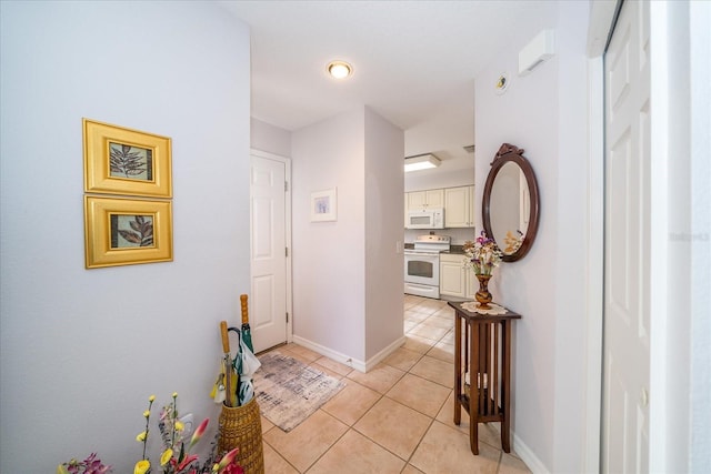 hallway with light tile patterned floors