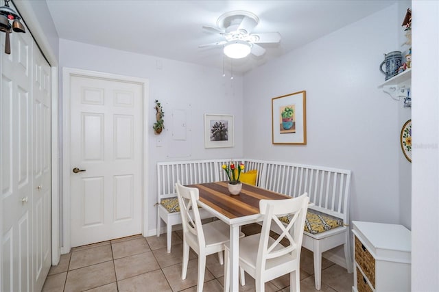 tiled dining space featuring ceiling fan and breakfast area