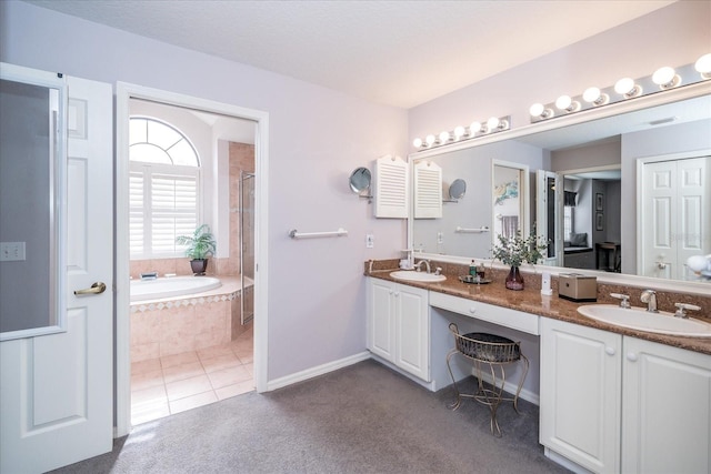 bathroom with tile patterned flooring, vanity, and plus walk in shower