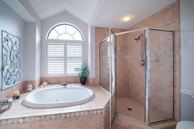 bathroom featuring separate shower and tub and vaulted ceiling