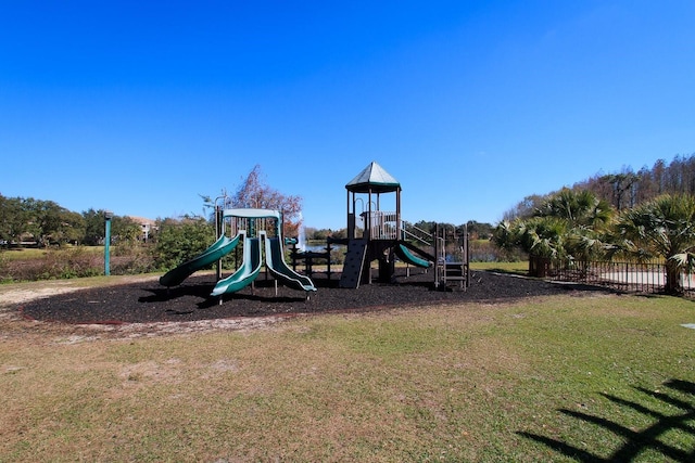 view of jungle gym with a lawn