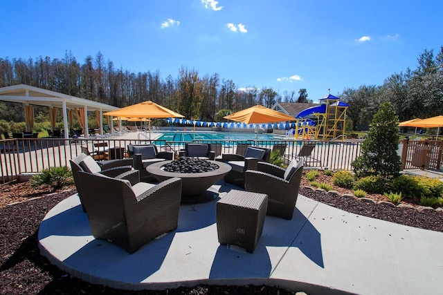 view of patio / terrace with a fenced in pool