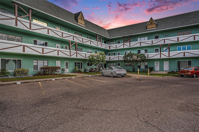 view of outdoor building at dusk