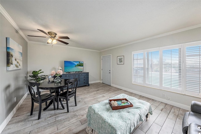 living room featuring a textured ceiling, ceiling fan, light hardwood / wood-style floors, and crown molding