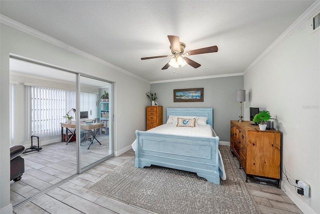 bedroom with a textured ceiling, a closet, ceiling fan, and ornamental molding