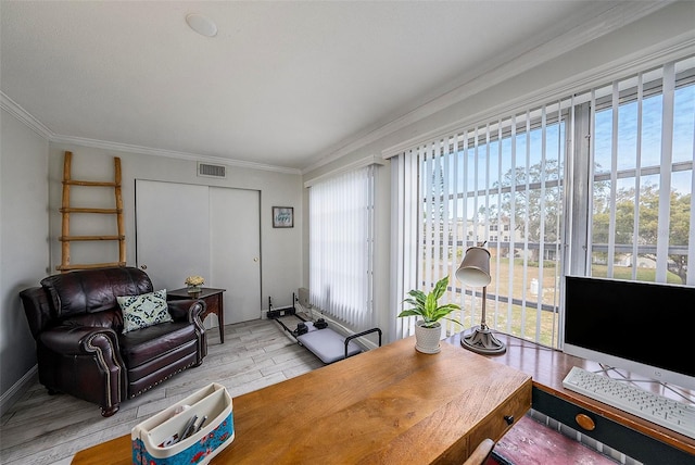 home office featuring crown molding and light hardwood / wood-style flooring