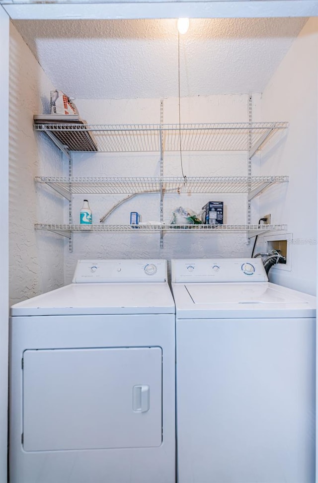 laundry room with washer and dryer