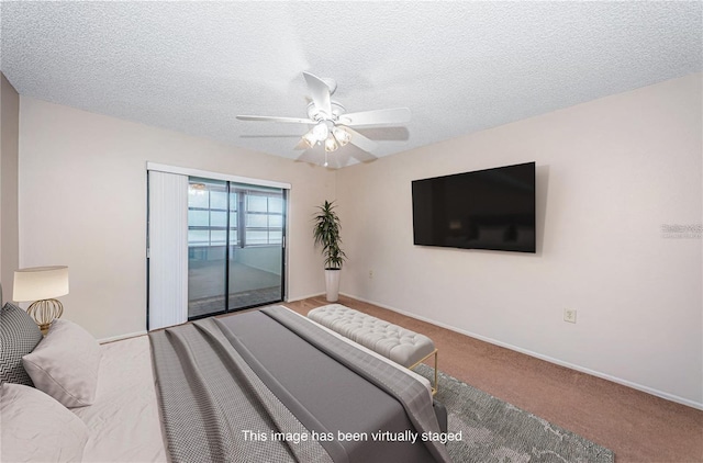 bedroom with access to exterior, carpet, a textured ceiling, and ceiling fan