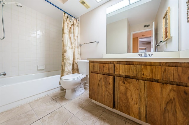 full bathroom featuring tile patterned flooring, shower / bath combination with curtain, vanity, and toilet