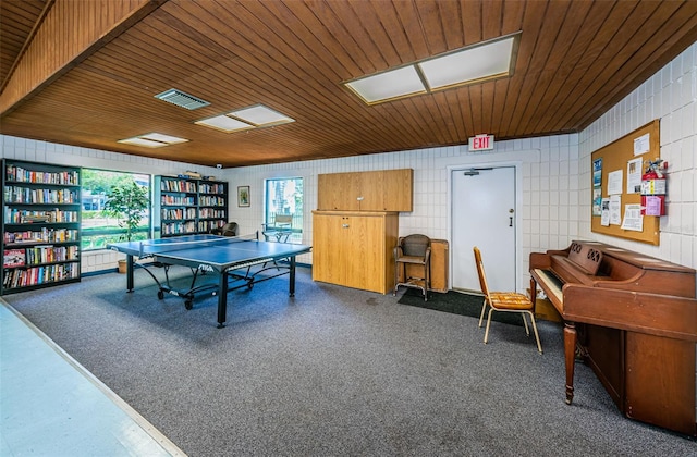 rec room with a wealth of natural light, wooden ceiling, and dark colored carpet