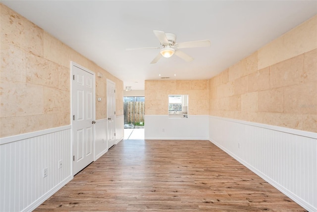 spare room featuring ceiling fan and wood-type flooring