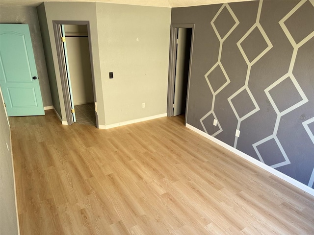 unfurnished room with light wood-type flooring