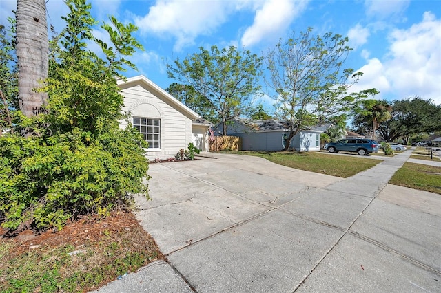 view of home's exterior with a yard