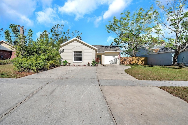 single story home with a front yard and a garage