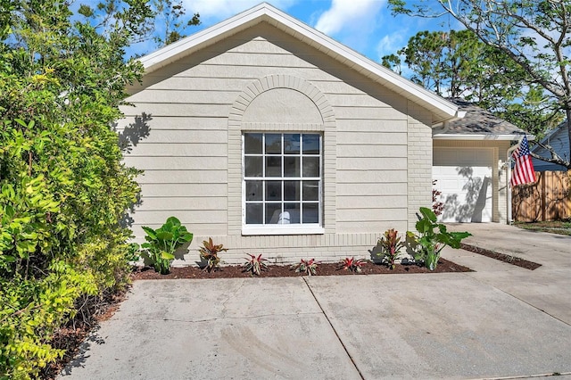 view of property exterior with a garage