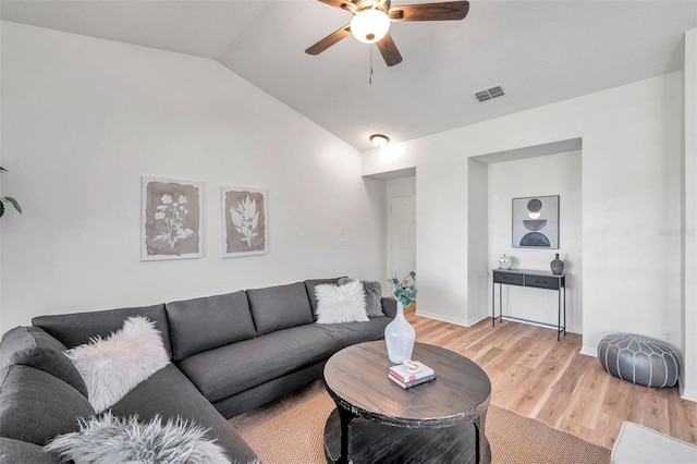 living room with light hardwood / wood-style flooring, ceiling fan, and lofted ceiling