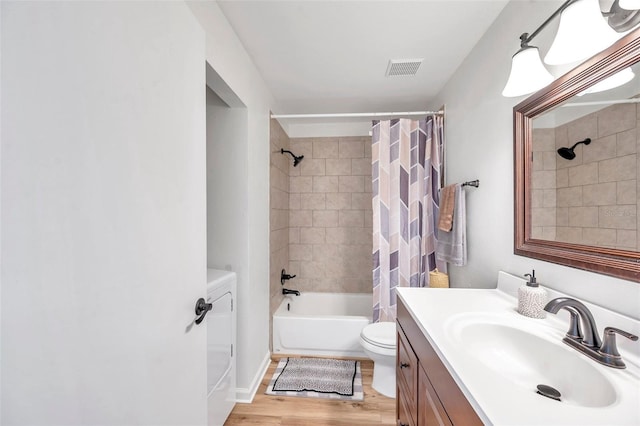 full bathroom featuring toilet, vanity, shower / bath combination with curtain, and hardwood / wood-style flooring