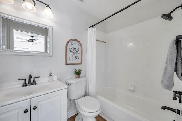 full bathroom with ceiling fan, wood-type flooring, toilet, vanity, and shower / tub combo