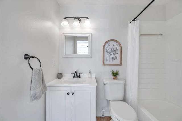 full bathroom with vanity, shower / tub combo, and toilet