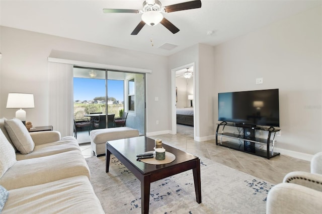 living room with ceiling fan and light tile patterned floors