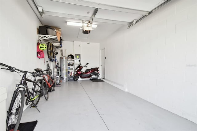 garage featuring water heater and a garage door opener