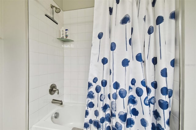 bathroom with shower / bath combo with shower curtain