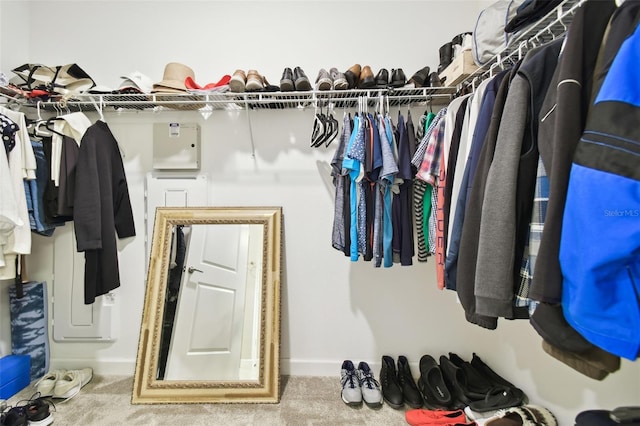 walk in closet featuring carpet