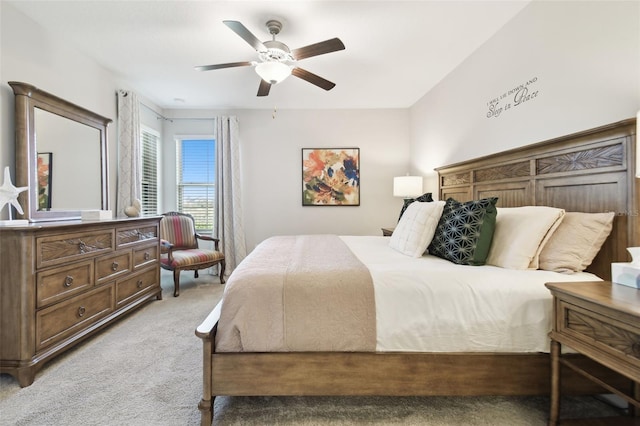 bedroom featuring ceiling fan and light colored carpet