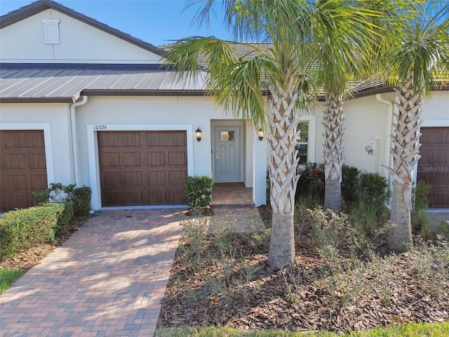 view of front of property with a garage