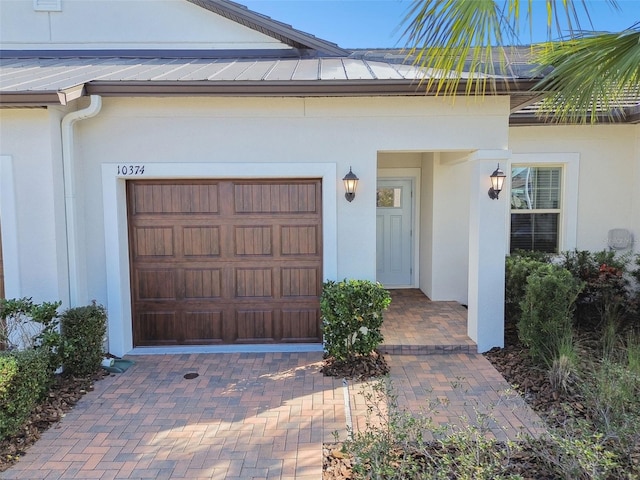 property entrance with a garage