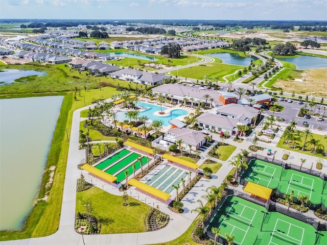 birds eye view of property with a water view