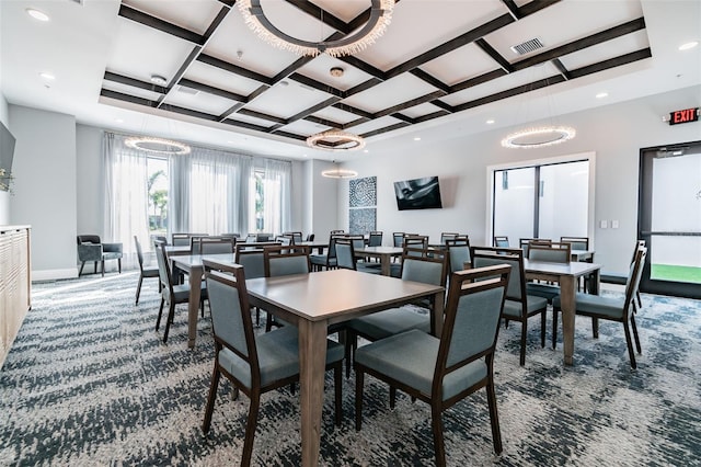 dining room with carpet floors and coffered ceiling