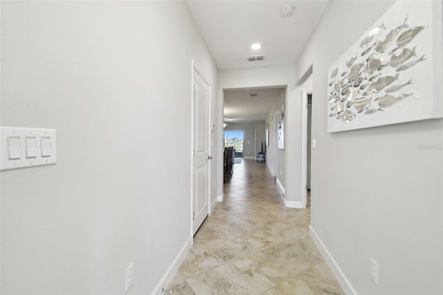 10374 Echo Dock Loop, San Antonio, FL 33576 - corridor featuring baseboards and light tile patterned flooring