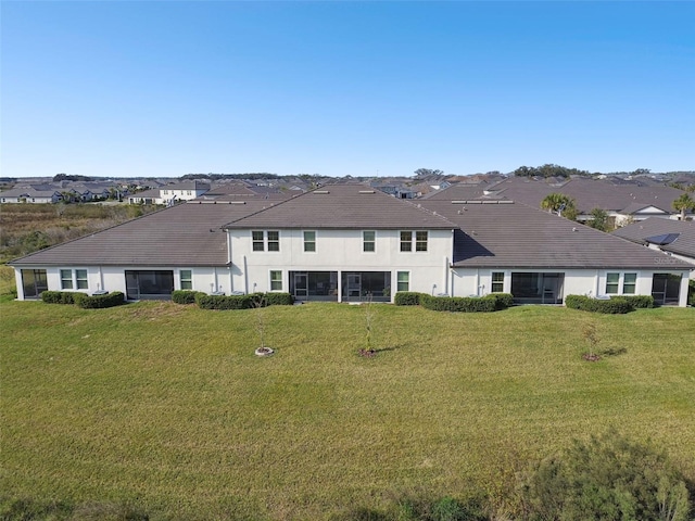10374 Echo Dock Loop, San Antonio, FL 33576 - rear view of property featuring a yard, a residential view, and stucco siding