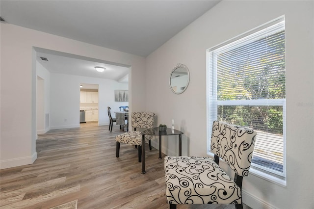 sitting room featuring light hardwood / wood-style floors