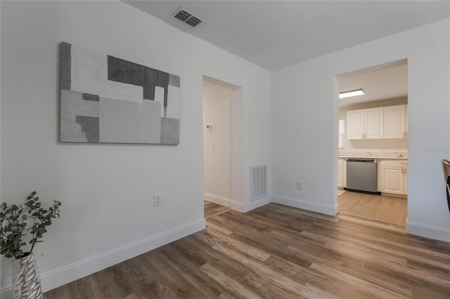 unfurnished living room with hardwood / wood-style flooring